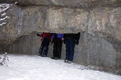 08 Peter Ryan, Jerome Ryan and Charlotte Ryan With Heads in Cave At Banff Grotto Canyon In Winter